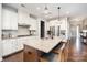 Modern kitchen features stainless steel appliances, granite countertops, and an island with bar stool seating at 3028 Quinebaug Rd, Fort Mill, SC 29715