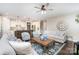 Spacious living room featuring hardwood floors and seamlessly connected to the modern kitchen and dining areas at 3028 Quinebaug Rd, Fort Mill, SC 29715