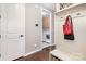Functional mudroom featuring a bench with shoe storage and easy access to the laundry room at 3028 Quinebaug Rd, Fort Mill, SC 29715