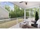 Cozy screened-in patio with seating area overlooking landscaped backyard at 3028 Quinebaug Rd, Fort Mill, SC 29715