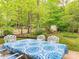 Enjoy outdoor dining on this spacious deck with lush greenery and trees at 3033 Beech Ct, Indian Trail, NC 28079