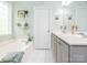 Serene bathroom featuring a double vanity, tub, and view into the walk-in closet at 3033 Beech Ct, Indian Trail, NC 28079