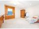 Spacious bedroom features a window bench, an armoire, and a comfortable chair at 3033 Beech Ct, Indian Trail, NC 28079