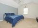 This bedroom offers neutral carpet, soothing wall colors and a ceiling fan at 3033 Beech Ct, Indian Trail, NC 28079