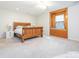 Spacious bedroom features a wooden bed frame, neutral carpet, and large windows at 3033 Beech Ct, Indian Trail, NC 28079