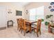 Inviting dining room with tile floors, a wooden table, and a window offering natural light at 3033 Beech Ct, Indian Trail, NC 28079