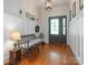 Welcoming foyer with hardwood floors, paneled walls, and a decorative front door with stained glass at 3033 Beech Ct, Indian Trail, NC 28079