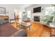 Inviting living room with a fireplace, hardwood floors, and plenty of natural light at 3033 Beech Ct, Indian Trail, NC 28079