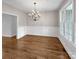 Spacious dining room featuring hardwood floors, a chandelier, and ample natural light at 312 Peach St, Shelby, NC 28150