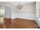 Elegant dining room with hardwood floors, wainscoting, chandelier and natural light at 312 Peach St, Shelby, NC 28150
