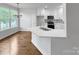 Modern kitchen with white cabinets, stainless steel appliances, and a center island at 312 Peach St, Shelby, NC 28150