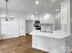 Modern kitchen with white cabinets, stainless steel appliances, and a center island at 312 Peach St, Shelby, NC 28150