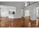 Open floor plan featuring hardwood floors, white walls, and an eat-in kitchen at 312 Peach St, Shelby, NC 28150