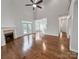 Open living room with a fireplace and access to the backyard through glass doors at 312 Peach St, Shelby, NC 28150
