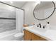 Stylish bathroom showcasing updated vanity, black fixtures, and modern tile work at 3423 Sudbury Rd, Charlotte, NC 28205