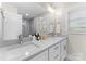 Bathroom featuring double sink vanity with contemporary fixtures and lighting at 3423 Sudbury Rd, Charlotte, NC 28205