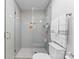 Bathroom featuring glass enclosed shower, modern tile, and sleek hardware at 3423 Sudbury Rd, Charlotte, NC 28205