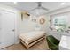 Bright bedroom featuring a single bed, modern decor, and natural light at 3423 Sudbury Rd, Charlotte, NC 28205