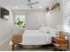 Cozy bedroom featuring natural light, ceiling fan, and wooden accents at 3423 Sudbury Rd, Charlotte, NC 28205