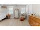 Bright bedroom with decoratively appointed chair, mirror and accessories at 3423 Sudbury Rd, Charlotte, NC 28205