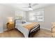 Comfortable bedroom with a ceiling fan, natural light, and tasteful decor at 3423 Sudbury Rd, Charlotte, NC 28205