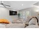Comfortable living room with tv and french doors to deck at 3423 Sudbury Rd, Charlotte, NC 28205