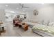 Bright living room seamlessly connects with an adjacent kitchen, featuring hardwood floors and a comfortable, modern aesthetic at 3423 Sudbury Rd, Charlotte, NC 28205