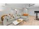 Spacious living room featuring a comfortable sofa and neutral decor at 3423 Sudbury Rd, Charlotte, NC 28205