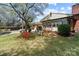Backyard featuring a custom swing and meticulous landscaping at 365 Pine Hill Rd, Salisbury, NC 28144
