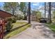 Backyard featuring a long driveway with mature trees and a storage shed at 365 Pine Hill Rd, Salisbury, NC 28144
