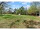 Expansive backyard features lush green grass and convenient storage shed at 365 Pine Hill Rd, Salisbury, NC 28144