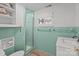 Bathroom featuring mint tile, a glass shower door, and a built in linen closet at 365 Pine Hill Rd, Salisbury, NC 28144