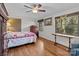 Bright bedroom with hardwood floors and multiple windows at 365 Pine Hill Rd, Salisbury, NC 28144