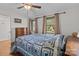 Bright bedroom with hardwood floors, natural light, and cozy quilt bedding at 365 Pine Hill Rd, Salisbury, NC 28144