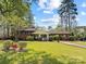 Charming brick home with a well-manicured lawn and mature landscaping at 365 Pine Hill Rd, Salisbury, NC 28144