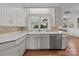 Bright kitchen featuring white cabinets and modern stainless steel appliances at 365 Pine Hill Rd, Salisbury, NC 28144