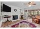 Living room with a fireplace, mounted television and sliding glass doors at 365 Pine Hill Rd, Salisbury, NC 28144
