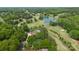Expansive aerial view of home on golf course with pool and lush landscaping at 3764 Glenn Oaks Dr, Maiden, NC 28650