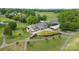 High angle aerial view of a golf course clubhouse with pool and golf carts at 3764 Glenn Oaks Dr, Maiden, NC 28650