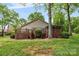 A spacious backyard features a wooden deck, screened porch, and lush lawn at 3764 Glenn Oaks Dr, Maiden, NC 28650