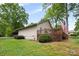 A well-maintained backyard featuring a spacious wooden deck and a lush green lawn at 3764 Glenn Oaks Dr, Maiden, NC 28650