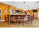 A warm and inviting bar area featuring wood accents, bar seating and a tv for entertainment at 3764 Glenn Oaks Dr, Maiden, NC 28650