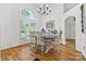 Elegant dining room with hardwood floors, a chandelier, and large windows allowing natural light at 3764 Glenn Oaks Dr, Maiden, NC 28650