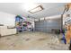 Spacious two-car garage offers ample storage space with shelves and room for vehicles at 3764 Glenn Oaks Dr, Maiden, NC 28650