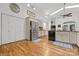 Modern kitchen featuring white cabinets, stainless steel appliances, and hardwood flooring at 3764 Glenn Oaks Dr, Maiden, NC 28650