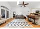 Open living area featuring cathedral ceiling, hardwood floors, and a kitchen island with seating at 3764 Glenn Oaks Dr, Maiden, NC 28650