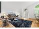Bright living room featuring hardwood floors, large windows, and comfortable seating arrangement at 3764 Glenn Oaks Dr, Maiden, NC 28650