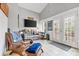 Comfortable living room with a leather recliner, television, and access to the outdoors at 3764 Glenn Oaks Dr, Maiden, NC 28650