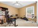 Bedroom staged as home office space with ample sunlight and an adjustable desk at 3764 Glenn Oaks Dr, Maiden, NC 28650