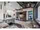 Modern bar area with unique granite countertops and stairs leading up to the living room at 385 Squirrel Ln, Clover, SC 29710